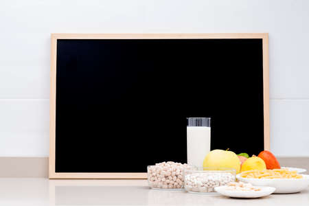 Still life with healthy food and a blackboard with space to copy. Conceptual photo about diets and healthy food.の写真素材