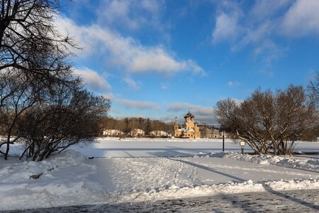 Views of Trinity Church in Ostankino, Moscow. View from street of the academician the Queen through the Ostankino pond. Winter, frosty, Sunny day.のeditorial素材