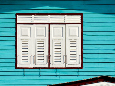 white wood window at blue houseの写真素材
