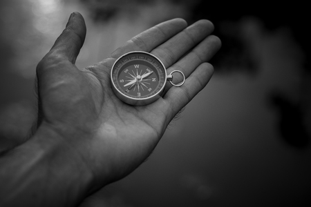 compass in the hand. - dark conceptの写真素材