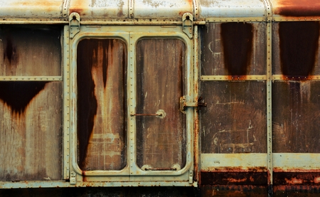 metal door of old and rusty bogie trainの写真素材