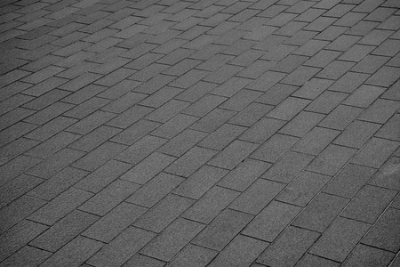 patterned paving tiles, ceramic brick floor background - monochromeの写真素材