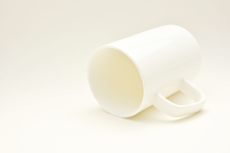 white ceramic cup of coffee with shadowの写真素材