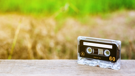 vintage audio cassette tapes on wooden desks in the morning. - vintage backdrop style.の写真素材
