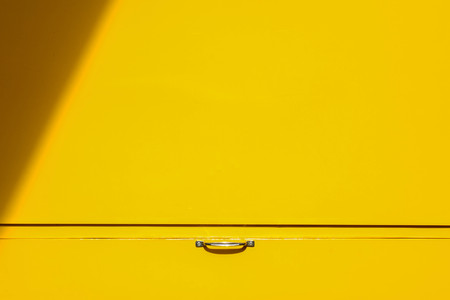 silver handle at yellow metal boxの写真素材