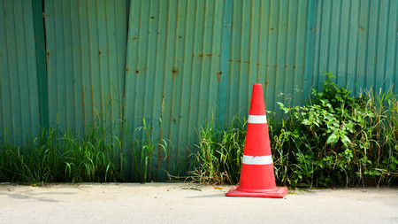 Traffic cone on footpathの写真素材