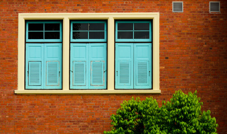 Close of window at antique brick buildingの写真素材