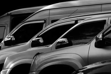 detail of a modern car wing mirror in the parking - light and shadow