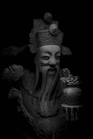 stone chinese nobility statue in thailand temple