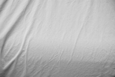 The surface of crumpled dirty grey canvasの写真素材