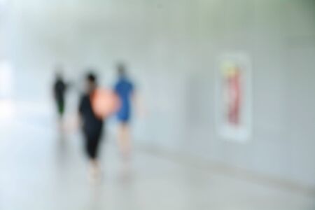 blurred image of people at sidewalk in the city.の写真素材