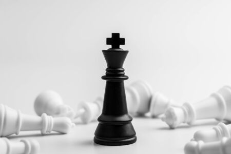 black king chess stand alone in among the losers. - Leader and business winner concept.の写真素材