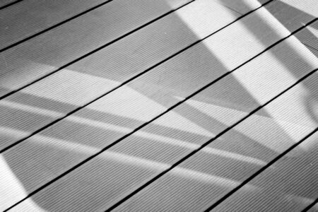 window shadow on wood floor background - monochromeの写真素材