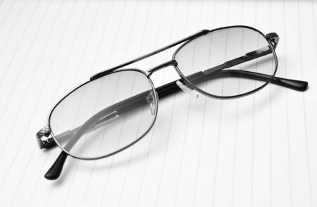 vintage glasses on paper backgroundの写真素材