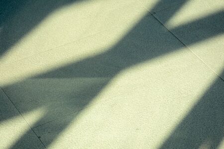 shadows from the window on tile floor.の写真素材