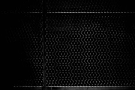 cage metal net in the darkの写真素材