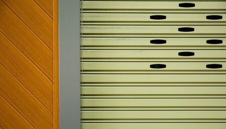 brown metal slide door at modern wood buildingの写真素材