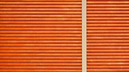 pattern and line of a orange vintage metal doorの写真素材