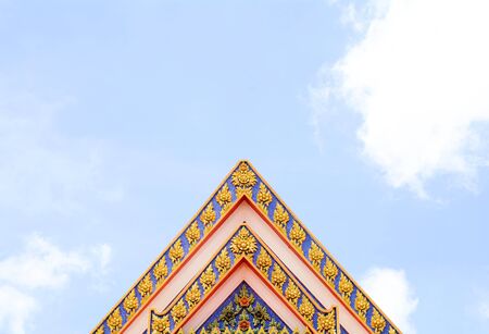 Ancient thai stucco pattern art on roof at temple - Buddha temple in Thailand