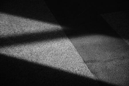 Abstract background of a shadows from the window on the floor.
