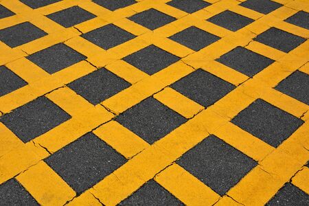 yellow line on asphalt road backgroundの写真素材