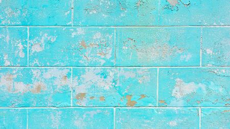 Old cracked painted blue wall - background textureの写真素材
