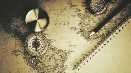 Nonthaburi, Thailand - July 13, 2018: Old compass on antique map. - vintage background style.