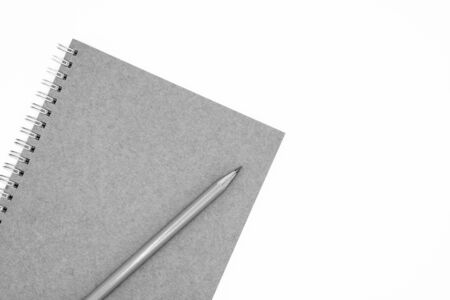 Note book and a pencil isolated on white background - monochromeの写真素材