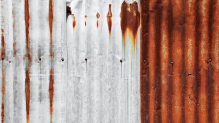 old and rusty galvanized iron wallの写真素材