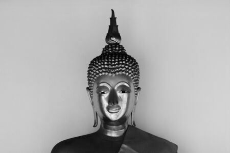 Face of buddha statue - light and shadowの写真素材