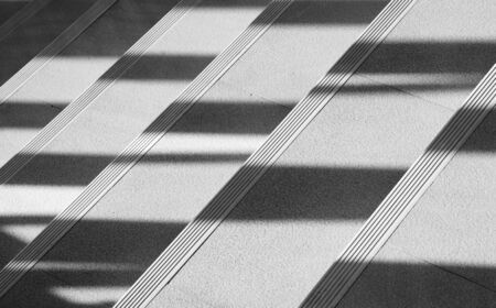 Abstract background of shadows from the window at the staircase. - monochromeの写真素材
