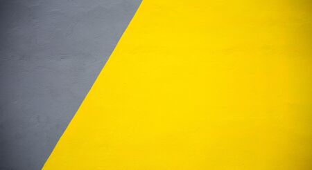 Yellow and grey cement wall textureの写真素材
