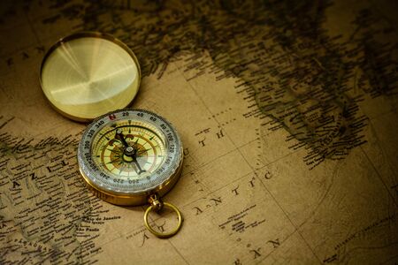 Bangkok, Thailand - June 6, 2018: Old compass on antique map.