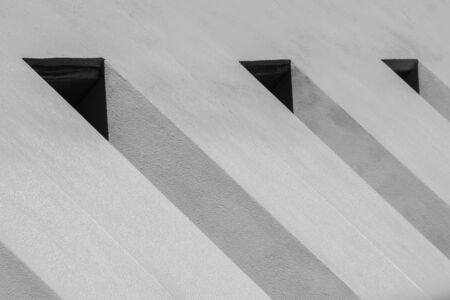 pattern of air ventilation at modern concrete building, light and shadow - monochrome