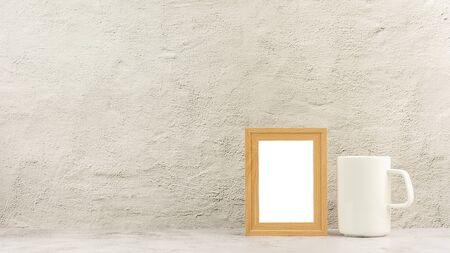 Classic wooden photo frame with a white coffee cup. - blank space for message and advertising background.の写真素材