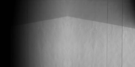 background grey concrete wall and the shadow at the modern buildingの写真素材