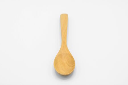 Wooden spoon isolated on white backgroundの写真素材