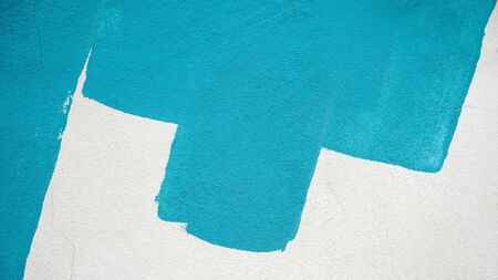 Brush strokes of blue paint on white concrete wall - backgroundの写真素材