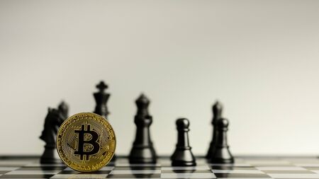 golden bitcoins on chess board. - winner of a business and economy concept.の写真素材