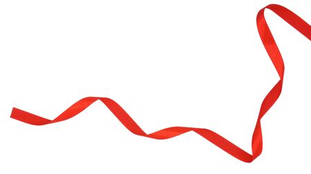 spiral of red fabric ribbon isolated on white backgroundの写真素材