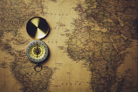 Old compass on antique map.
