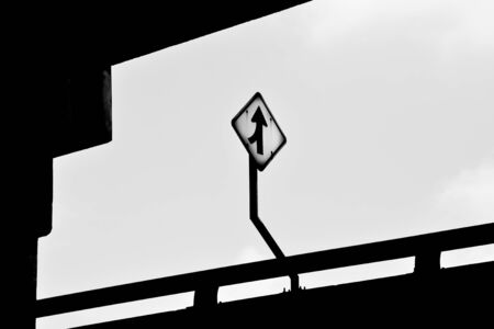 go straight or turn left traffic sign at the highwayの写真素材