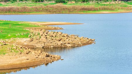 stone coast at the dam in the dry season.