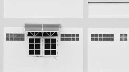 wooden window at white concrete buildings.の写真素材