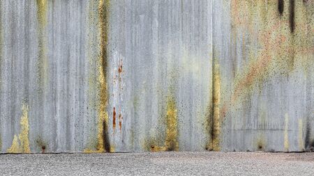abandoned and weathered corrugated zinc sheet wall.の写真素材