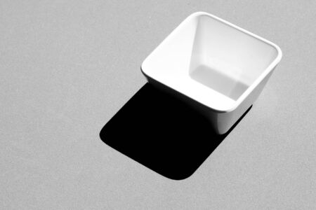 Square Bowl empty on grey background - monochromeの写真素材