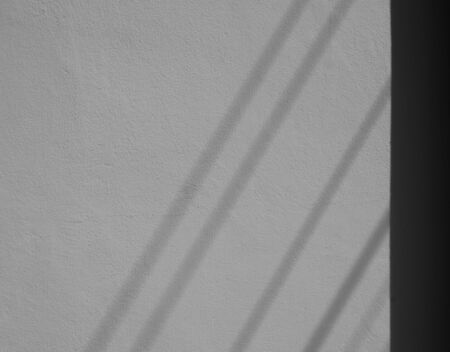 shadow of a wires on white concrete wall - backgroundの写真素材