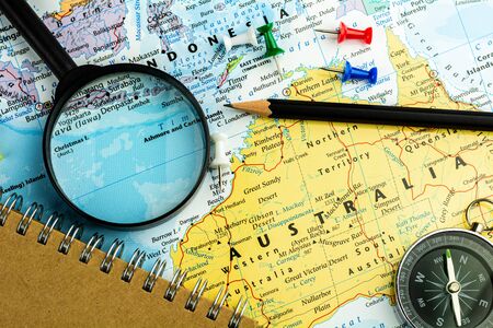 note device on australia map. - economic and business concept.の写真素材