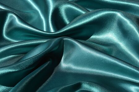 Emerald wavy silk background textureの写真素材