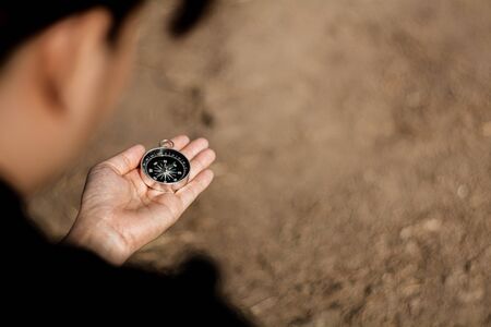 girl holding a compass. - transportation and travel plan concept.の写真素材